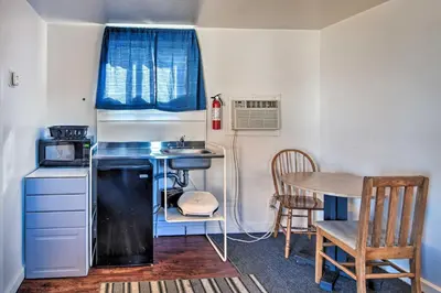 a small kitchen with a sink and a table at Vacation Rental in Loveland 1 Mi to Downtown! in Loveland