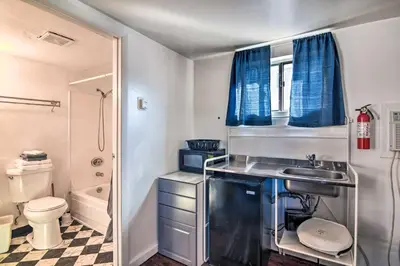 a small bathroom with a sink and a toilet at Vacation Rental in Loveland 1 Mi to Downtown! in Loveland