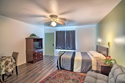 a bedroom with a bed and a ceiling fan at Loveland Vacation Rental Pets Welcome in Loveland