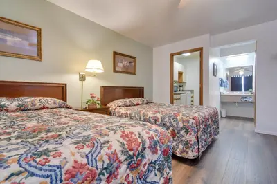 a hotel room with two beds and a bathroom at Loveland Vacation Rental Pets Welcome in Loveland
