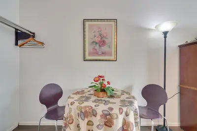 a dining room table with chairs and a plant on it at Loveland Vacation Rental Pets Welcome in Loveland