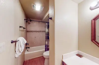 a bathroom with a toilet and a shower at The Retreat at Grand Lake in Grand Lake