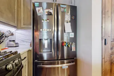 a large stainless steel refrigerator in a kitchen at Frisco Home Base in Frisco