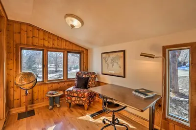 a home office with a desk and a chair at 5 Mi to Dtwn Denver Peaceful Lakewood Home! in Lakewood