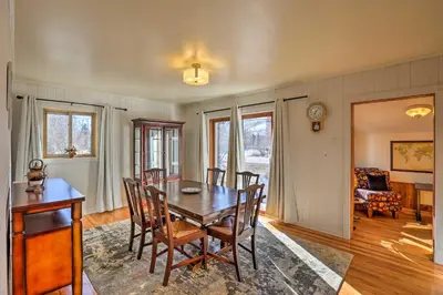 a dining room with a table and chairs at 5 Mi to Dtwn Denver Peaceful Lakewood Home! in Lakewood