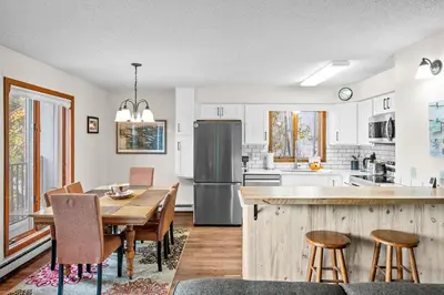 a kitchen and dining room with a table and chairs at 265 Forest Trail in Winter Park