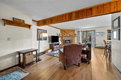 a living room with a chair and a table at 265 Forest Trail in Winter Park