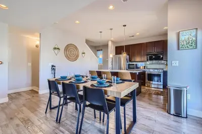 a kitchen and dining room with a table and chairs at 2332 N Clay Street Unit #3 in Denver