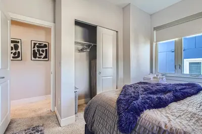 a bedroom with a large bed and a window at 2332 N Clay Street Unit #3 in Denver