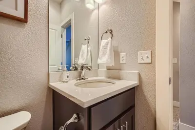 a bathroom with a sink and a mirror at 2332 N Clay Street Unit #3 in Denver