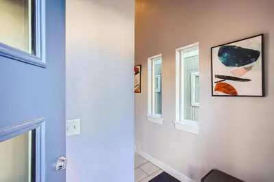 a hallway with a door and a window at 2332 N Clay Street Unit #3 in Denver