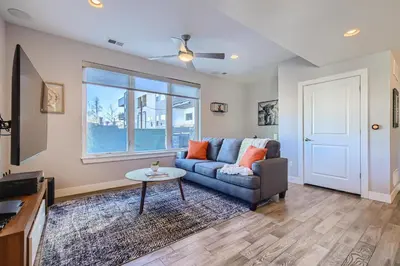 a living room with a couch and a table at 2332 N Clay Street Unit #3 in Denver