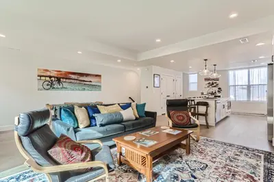 a living room with a couch and a table at 5419 Allison St, Unit G in Arvada