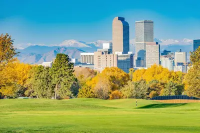 a golf course with the city in the background at 5419 Allison St, Unit G in Arvada