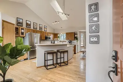 a kitchen with a counter and stools at 6022 Yank Ct in Arvada