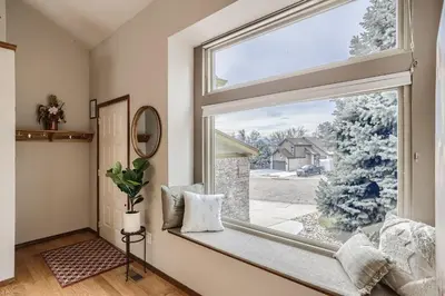 a window seat in a room with a large window at 6022 Yank Ct in Arvada