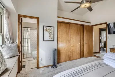 a bedroom with a bed and a ceiling fan at 6022 Yank Ct in Arvada