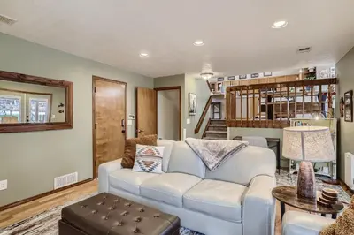 a living room with a white couch and a table at 6022 Yank Ct in Arvada