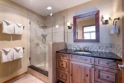 a bathroom with a shower and a sink and a mirror at Zephyr Mountain Lodge, Condo - 3 Bedroom Select-Rated Condo 1609 condo in Winter Park