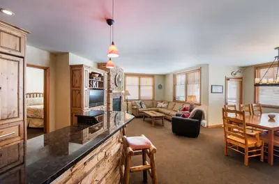 a living room with a kitchen and a dining room at Zephyr Mountain Lodge, Condo - 3 Bedroom Select-Rated Condo 1609 condo in Winter Park