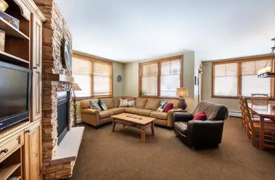 a living room with a couch and a tv at Zephyr Mountain Lodge, Condo - 3 Bedroom Select-Rated Condo 1609 condo in Winter Park
