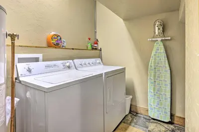 a laundry room with a washing machine and a sink at Mountainside Winter Park Ski Home with Hot Tub in Winter Park