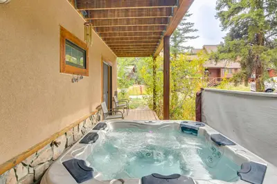 a hot tub on the back of a house at Mountainside Winter Park Ski Home with Hot Tub in Winter Park