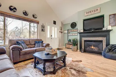 a living room with a couch and a fireplace at Denver Townhome in Highlands with Spacious Yard! in Denver