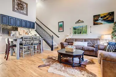 a living room with a couch and a table at Denver Townhome in Highlands with Spacious Yard! in Denver