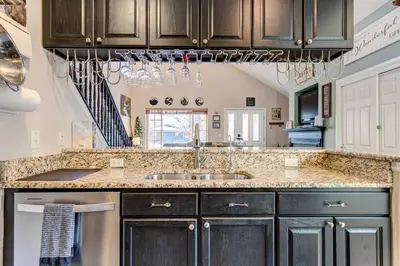 a kitchen with a sink and a counter at Denver Townhome in Highlands with Spacious Yard! in Denver