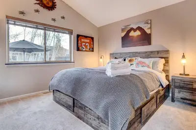 a bedroom with a large bed and a window at Denver Townhome in Highlands with Spacious Yard! in Denver