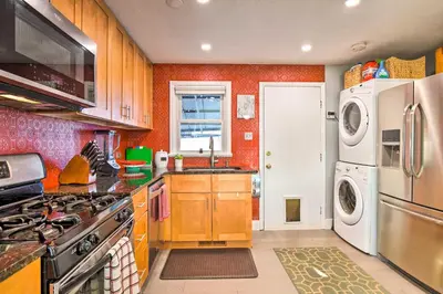 a kitchen with a sink and a stove top oven at Less Than 1 Mi to Empower Field Denver Vacation Rental in Denver