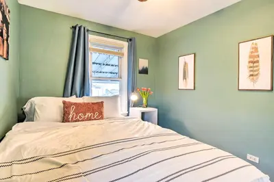 a bedroom with a bed and a window at Less Than 1 Mi to Empower Field Denver Vacation Rental in Denver