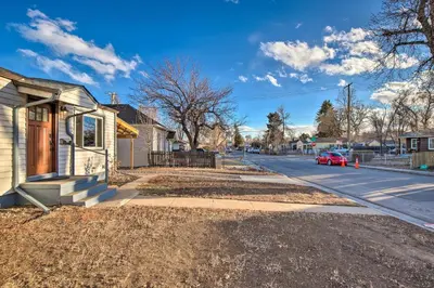 a house on the side of a street at Less Than 1 Mi to Empower Field Denver Vacation Rental in Denver