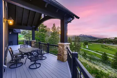 a patio with a table and chairs on a deck at NEW LISTING! Après & Fairway Retreat home in Breckenridge