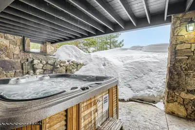 a jacuzzi tub in a room with a mountain at NEW LISTING! Après & Fairway Retreat home in Breckenridge