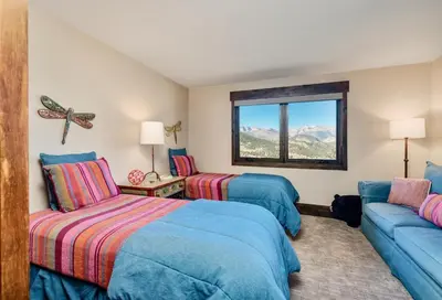 a hotel room with two beds and a couch at Moose Den Luxury Vacation Home at Windcliff home in Estes Park