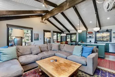a living room with a couch and a table at Moose Den Luxury Vacation Home at Windcliff home in Estes Park