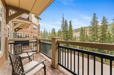 a balcony with two chairs and a view at Lone Eagle 3017 in Keystone