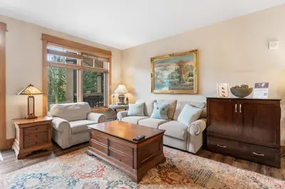 a living room with a couch and a table at Lone Eagle 3017 in Keystone