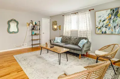 a living room with a couch and a table at Denver Vacation Rental about 3 Mi to Downtown! in Denver