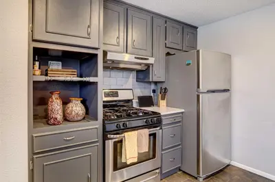 a kitchen with a stove and a refrigerator at Denver Vacation Rental about 3 Mi to Downtown! in Denver