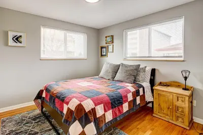 a bedroom with a bed and two windows at Denver Vacation Rental about 3 Mi to Downtown! in Denver