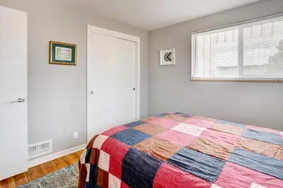 a bedroom with a bed with a colorful quilt at Denver Vacation Rental about 3 Mi to Downtown! in Denver
