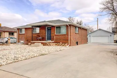 a brick house with a driveway in front of it at Denver Vacation Rental about 3 Mi to Downtown! in Denver