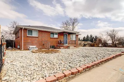 a house with a lot of rocks in front of it at Denver Vacation Rental about 3 Mi to Downtown! in Denver
