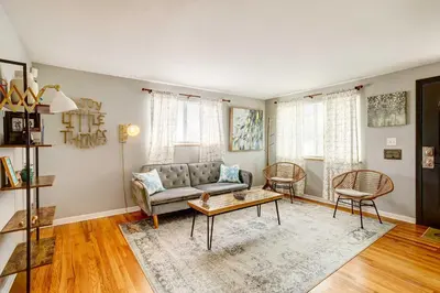 a living room with a couch and a table at Denver Vacation Rental about 3 Mi to Downtown! in Denver