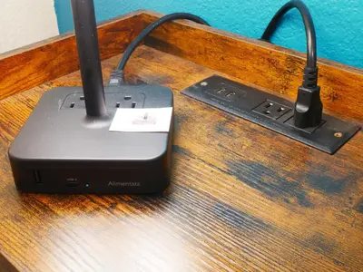 a black router sitting on top of a wooden table at Private Basement, Bath, Living Area In Morrison in Morrison