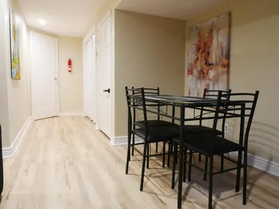 a dining room with a table and chairs at Private Basement, Bath, Living Area In Morrison in Morrison