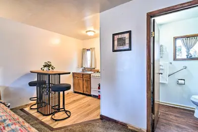 a room with a small table and a bathroom at Loveland Vacation Rental - 1 Mile to Lake! in Loveland